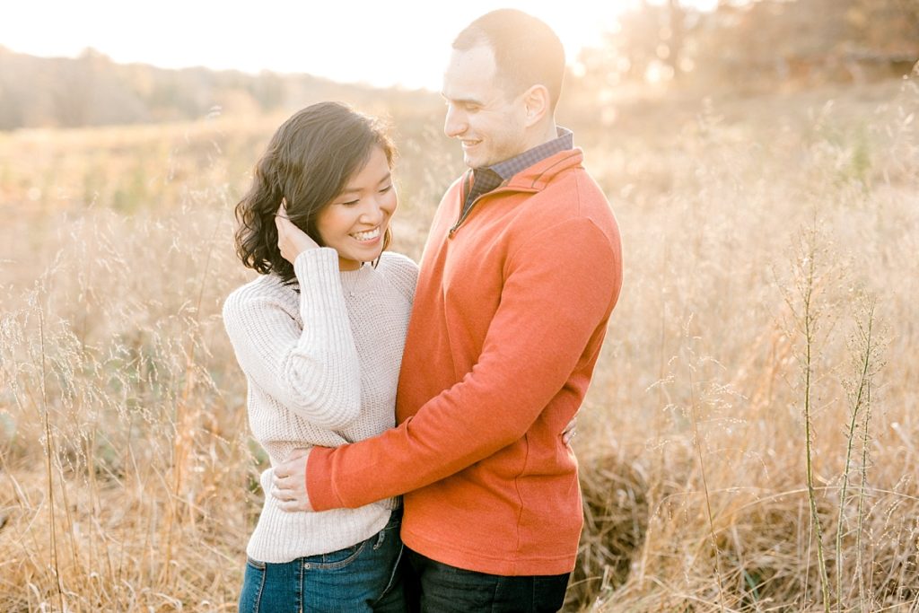 valley forge engagement session in the fall with couple hugging