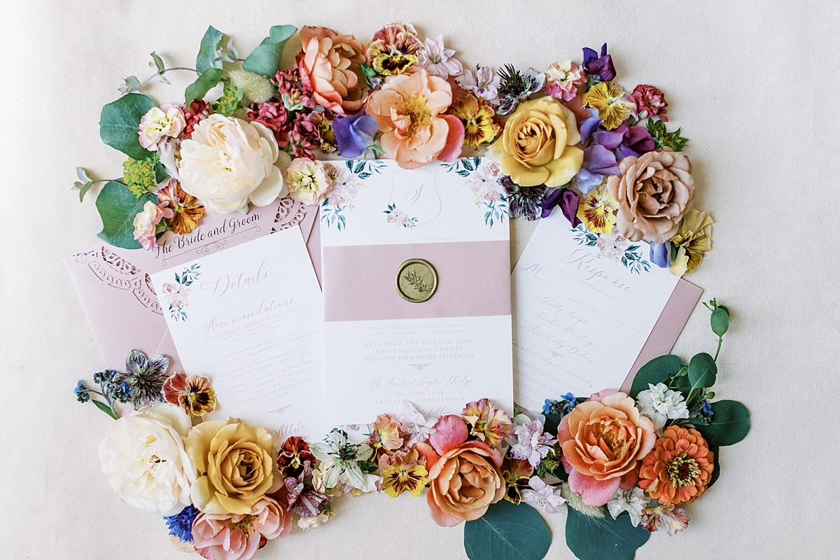 floral flat lays with pinks, yellows, and pansies and stationary by RSVP love

