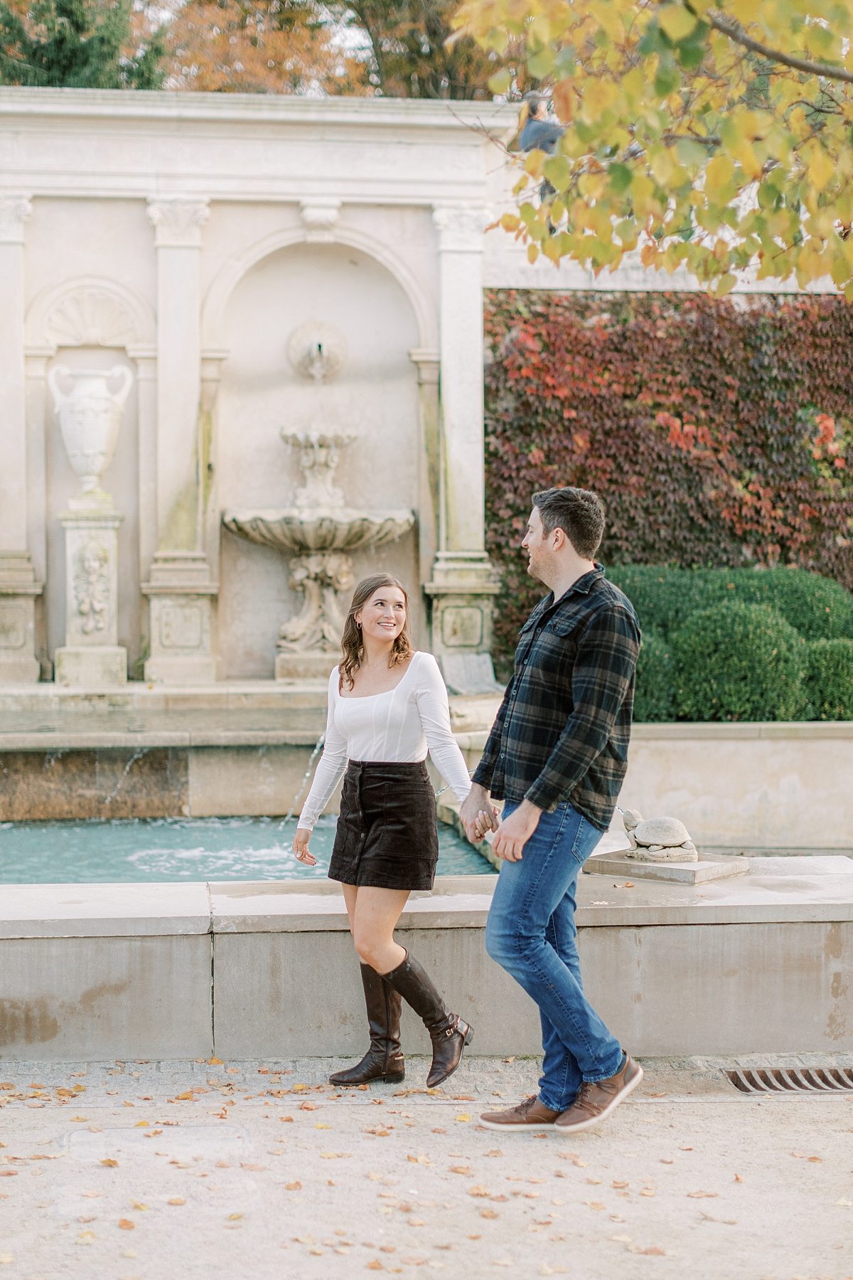 Fall Longwood Gardens engagement session by the fountain pond