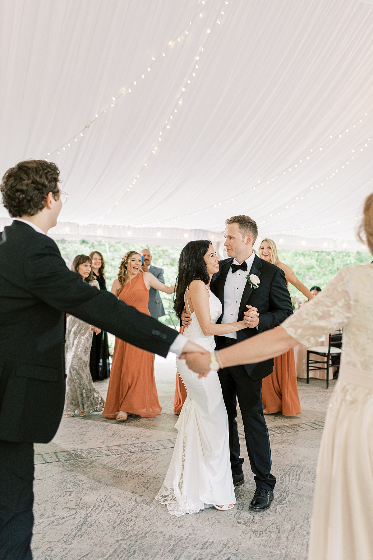 first dance with family surrounding couple at moonstone Manor wedding