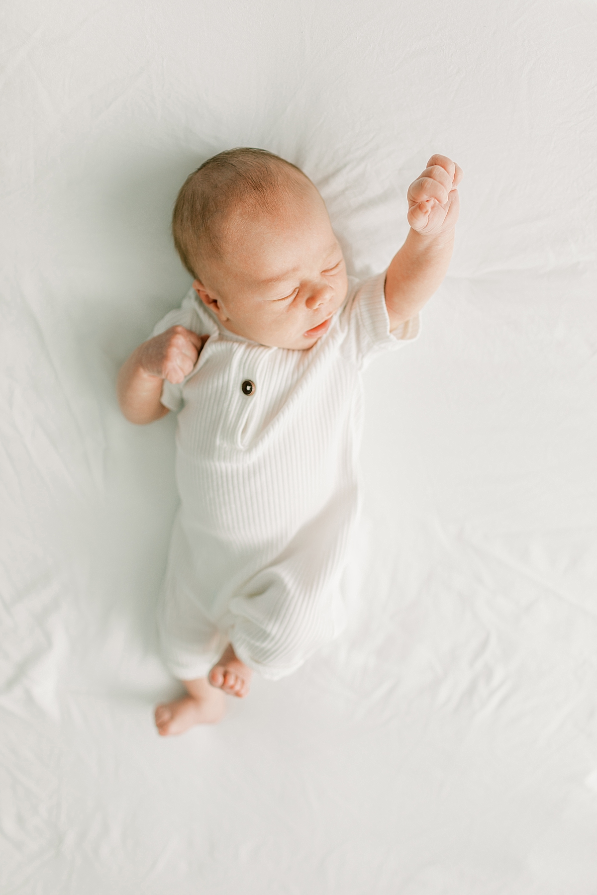 Rebecca Shivers Photography newborn photography session baby boy stretching