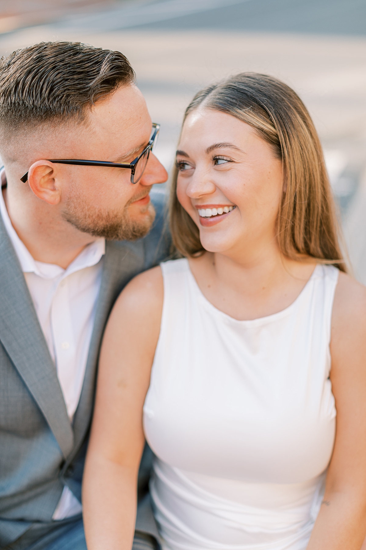 couple laughing together during engagement photo session