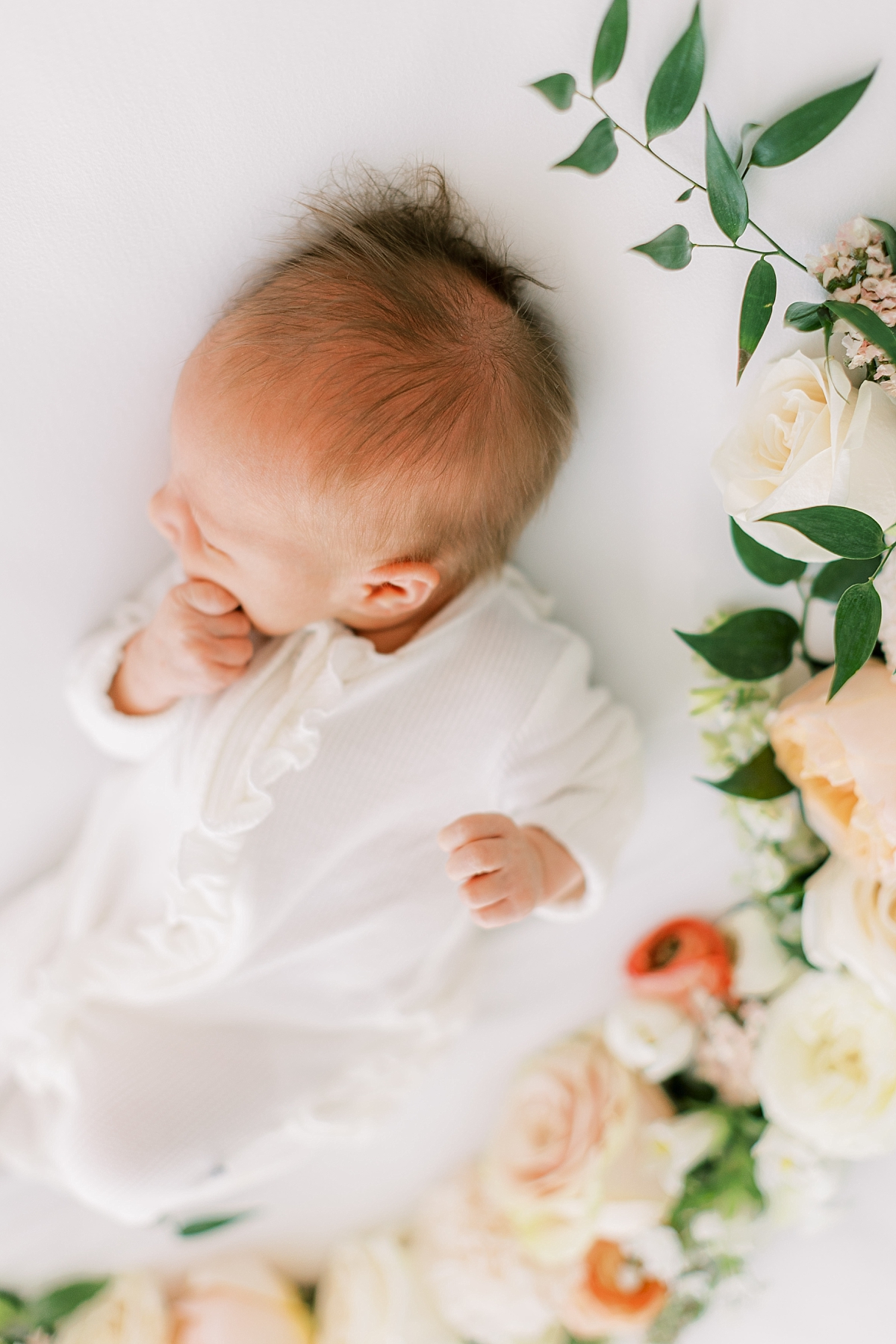 newborn baby girl with florals photo studio