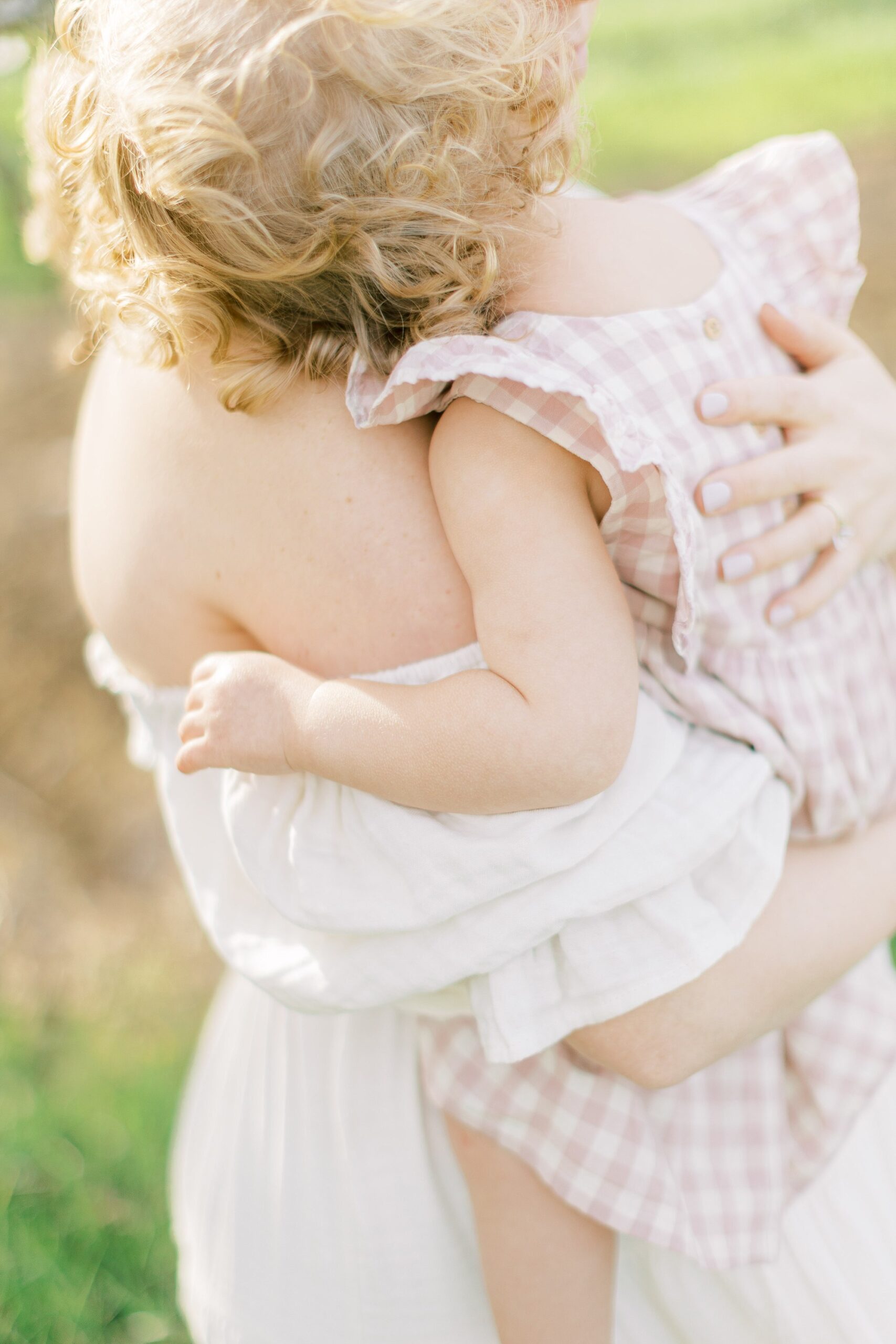 maternity session in an orchard in Lancaster county close up of mom hugging baby