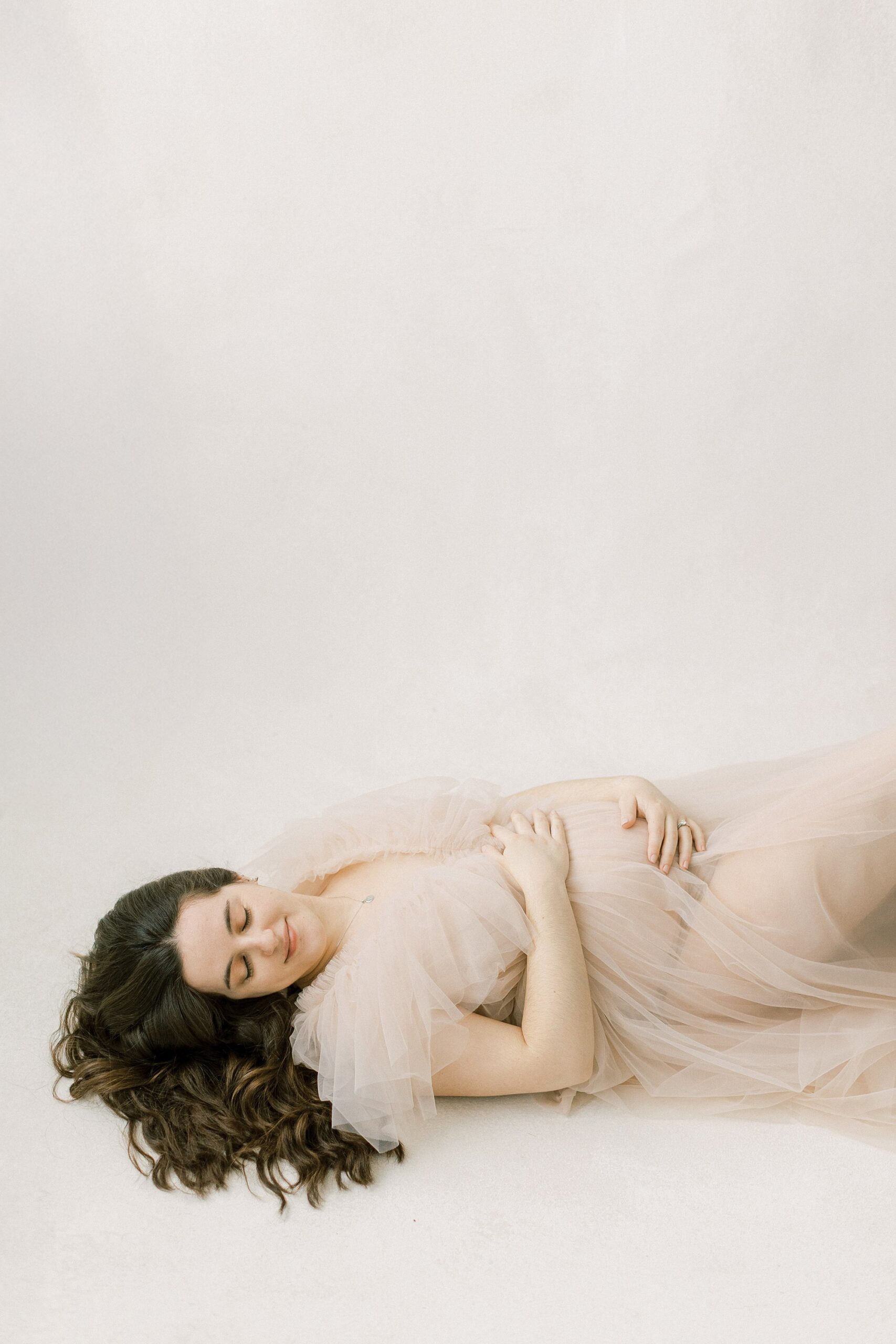 fine art Lancaster, PA indoor maternity session with tulle gown for moms in Lancaster, Lititz, Harrisburg, and King of Prussia