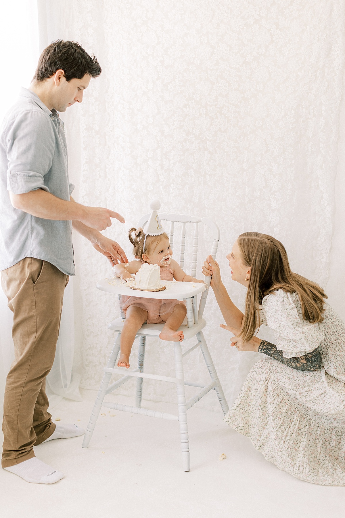 Lancaster, PA first birthday milestone session eating cake with mom and dad