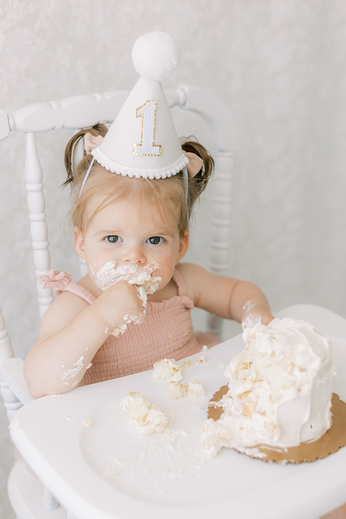 Lancaster, PA first birthday milestone session eating cake with icing all over