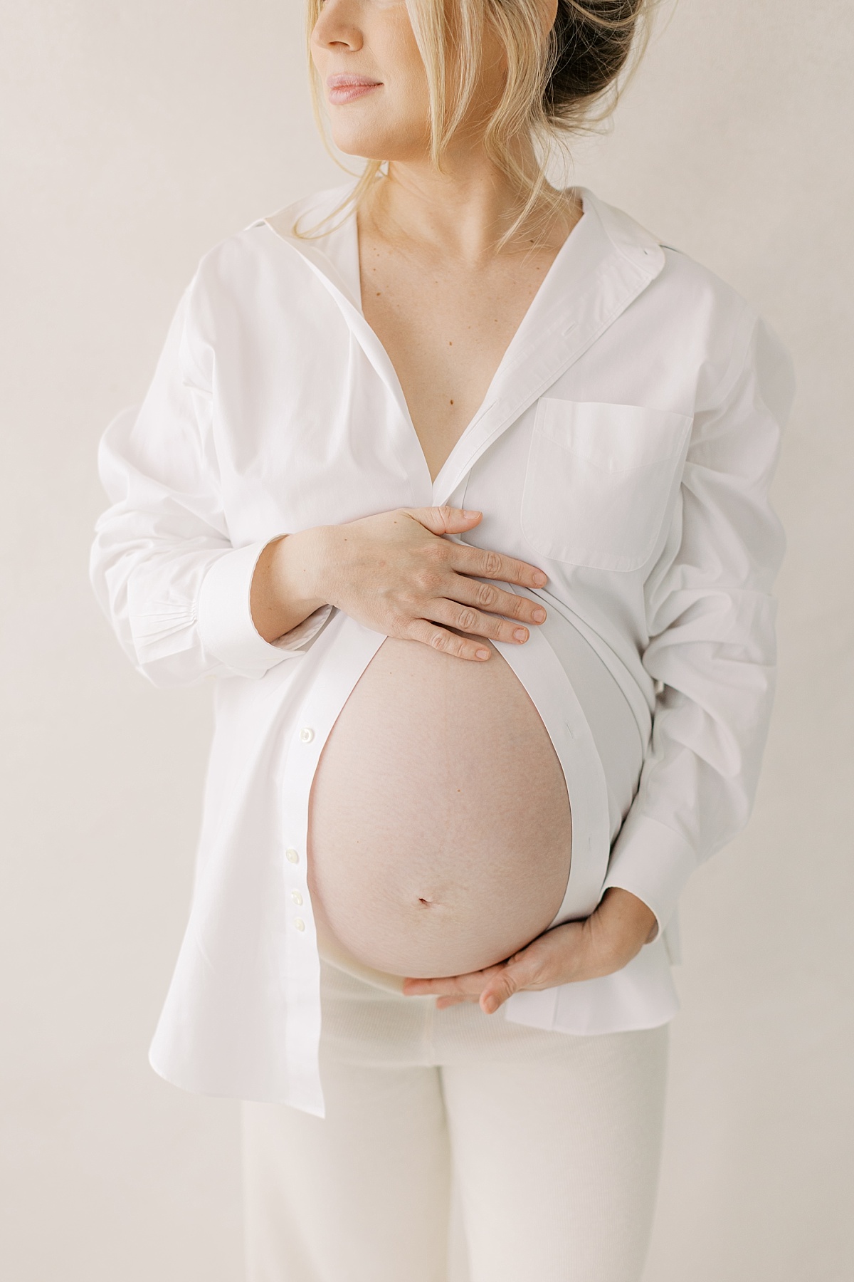 lancaster pa maternity session in winter, long with white button down shirt focus on baby bump