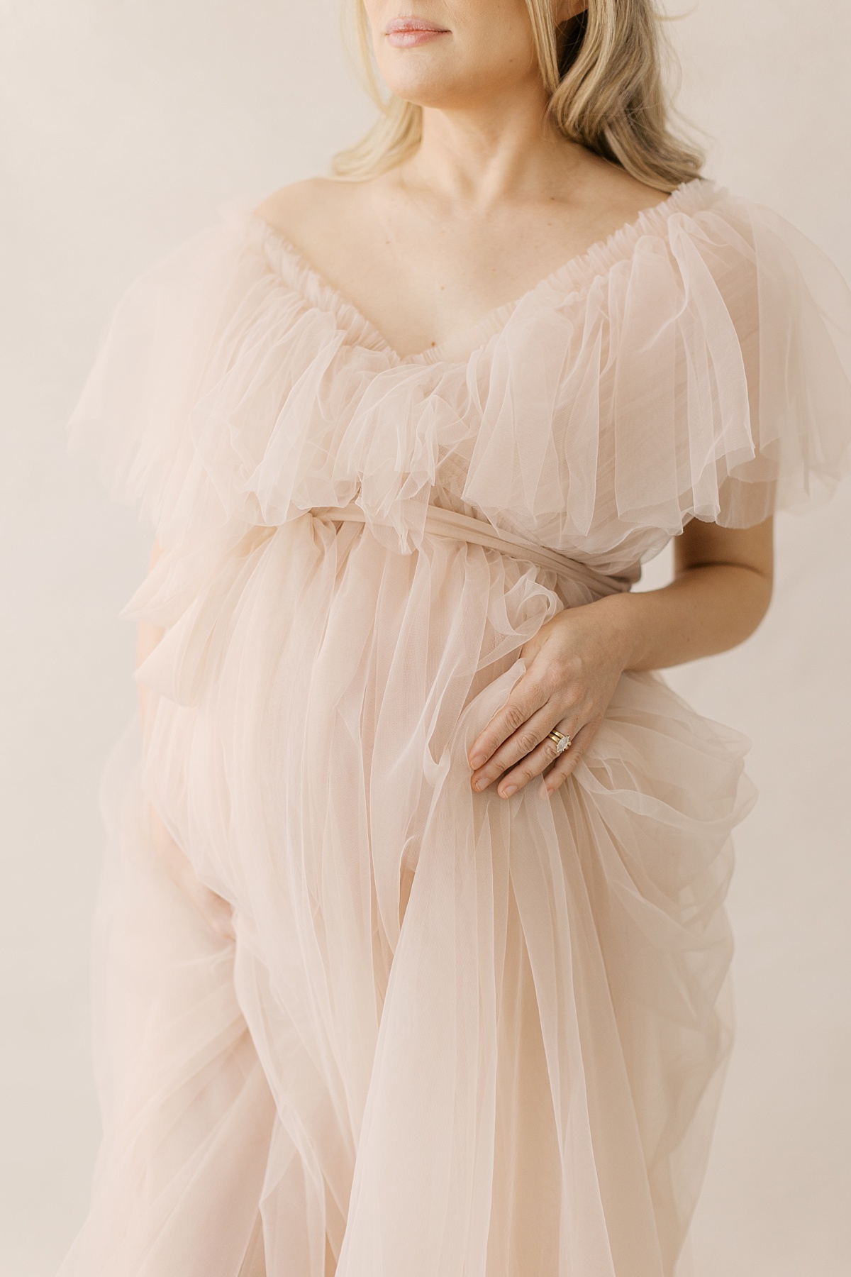 lancaster pa maternity session in winter, long tulle dress up close of belly