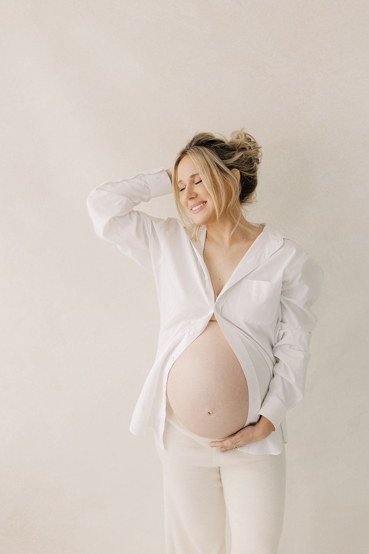 lancaster pa maternity session in winter, long with white button down shirt mom smiling